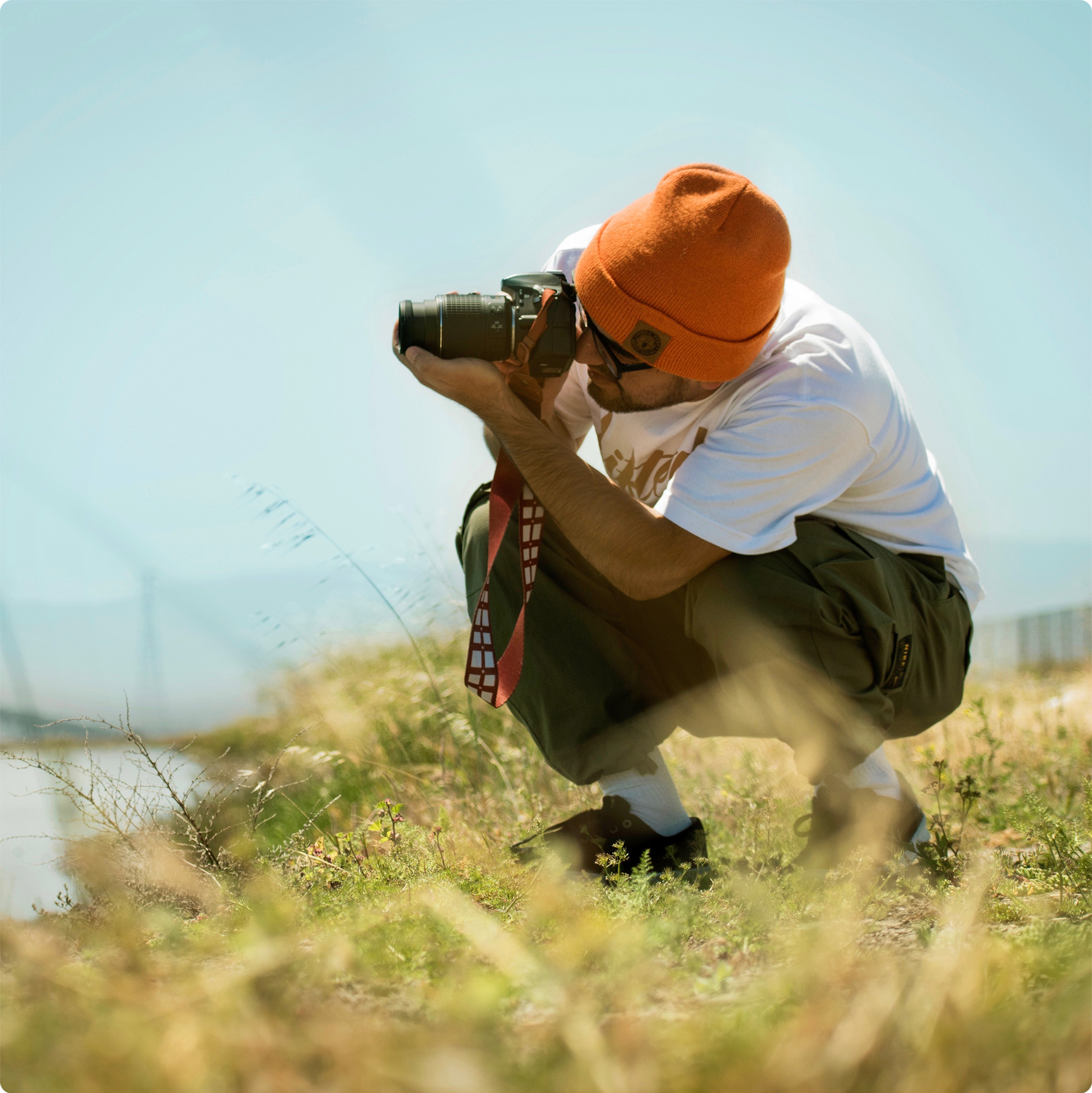 Rey photographing near the water
